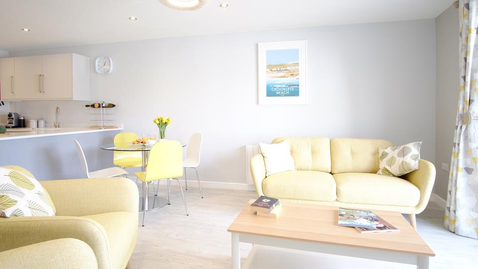 The open plan sitting room, kitchen and dining room is wonderfully light and airy, helping you to make the most of the Cornish sun.