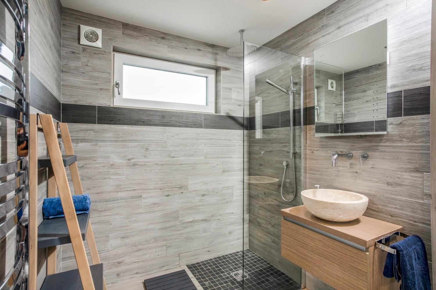 Wash off sandy toes in the shower after a day on Crooklets Beach.