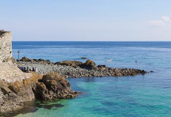 Walk around to Porthgwidden and enjoy lunch in the beach cafe.