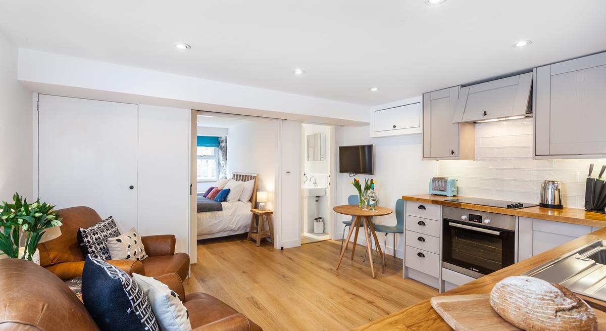 The living area is open plan, creating a delightful free-flowing space to cook and relax in.