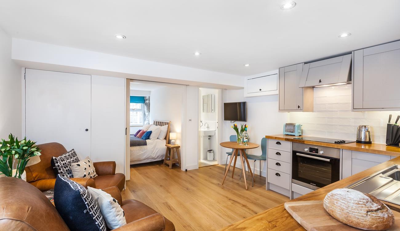 The living area is open plan, creating a delightful free-flowing space to cook and relax in.