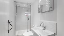 Freshen up before a night out in the chic, minimalist bathroom.