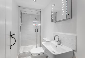 Freshen up before a night out in the chic, minimalist bathroom.
