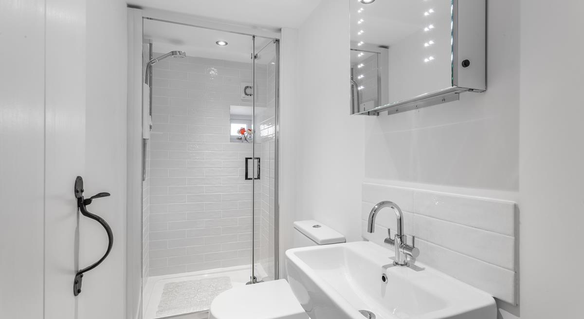 Freshen up before a night out in the chic, minimalist bathroom.