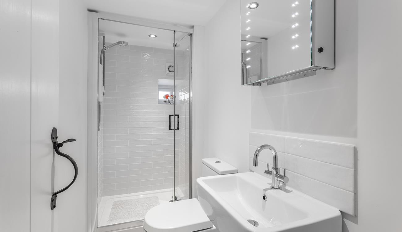 Freshen up before a night out in the chic, minimalist bathroom.