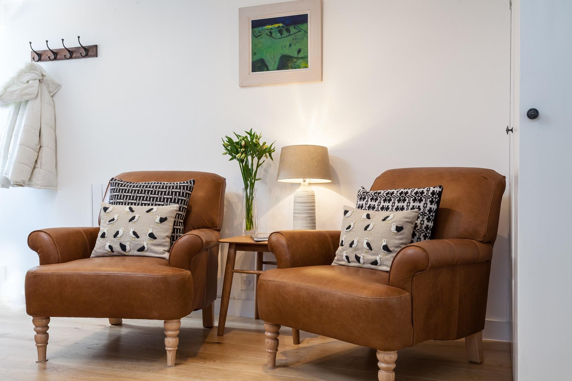 Cosy armchairs offer the perfect spot to snuggle down with a good book and a cup of tea.