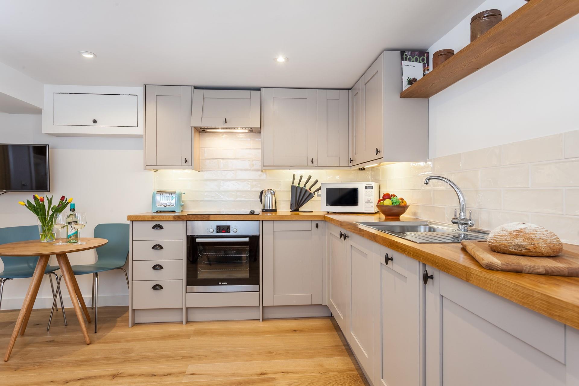 Fitted with modern appliances, the kitchen makes it a breeze to whip up home-cooked meals.