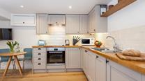 Fitted with modern appliances, the kitchen makes it a breeze to whip up home-cooked meals.