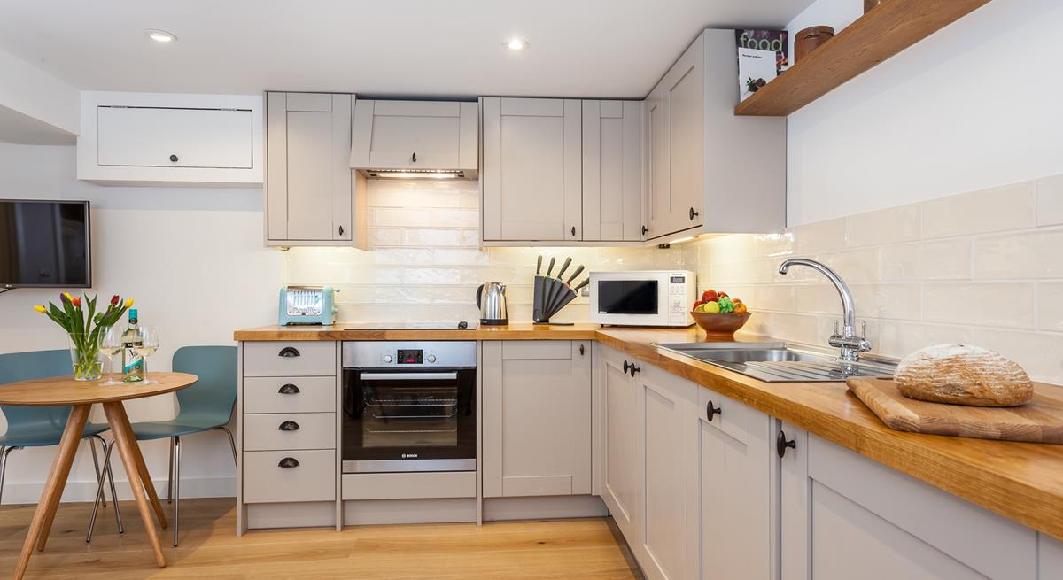 Fitted with modern appliances, the kitchen makes it a breeze to whip up home-cooked meals.