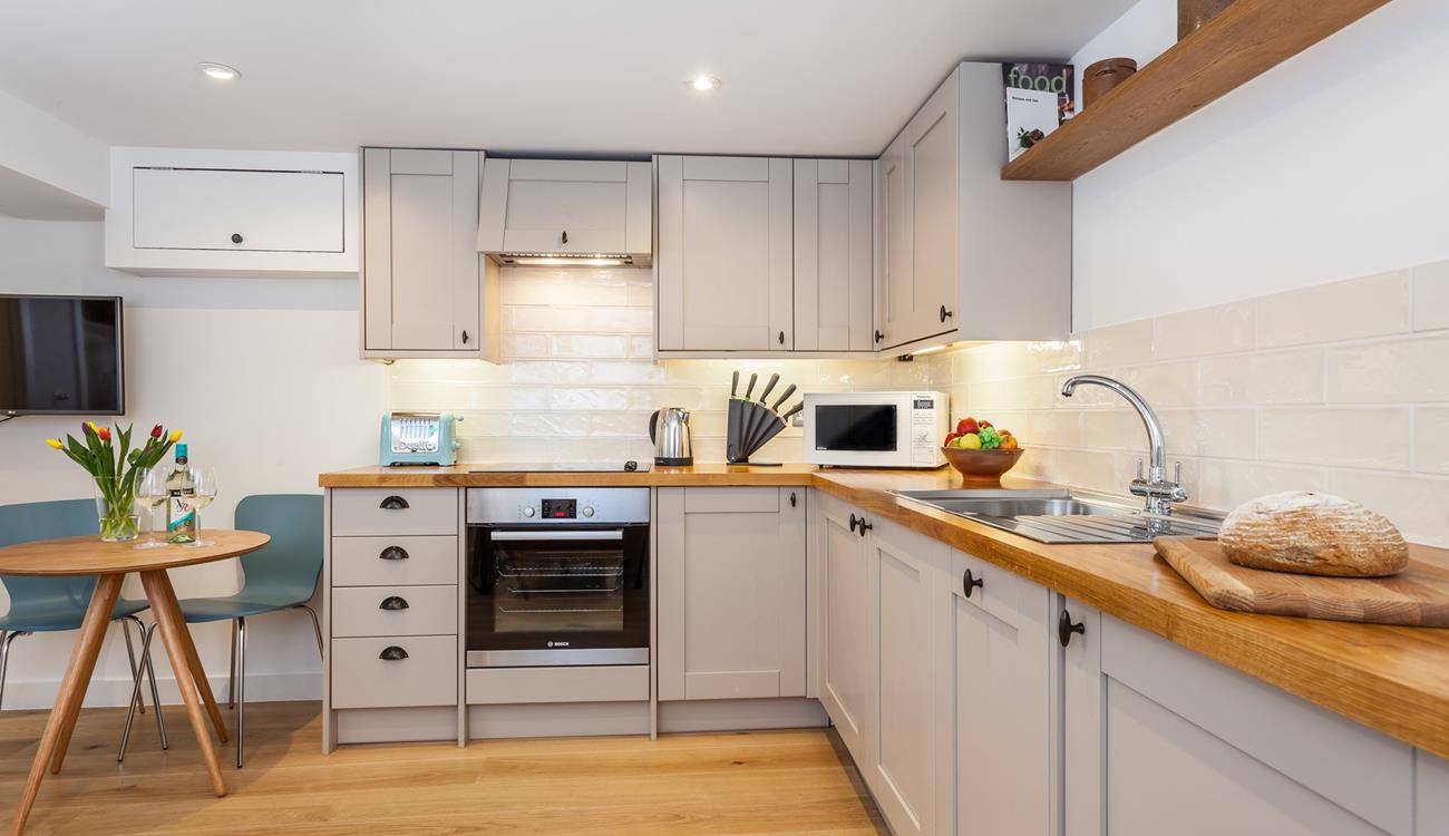 Fitted with modern appliances, the kitchen makes it a breeze to whip up home-cooked meals.