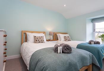 Bedroom 2 has comfortable twin beds perfect for young adults or children.