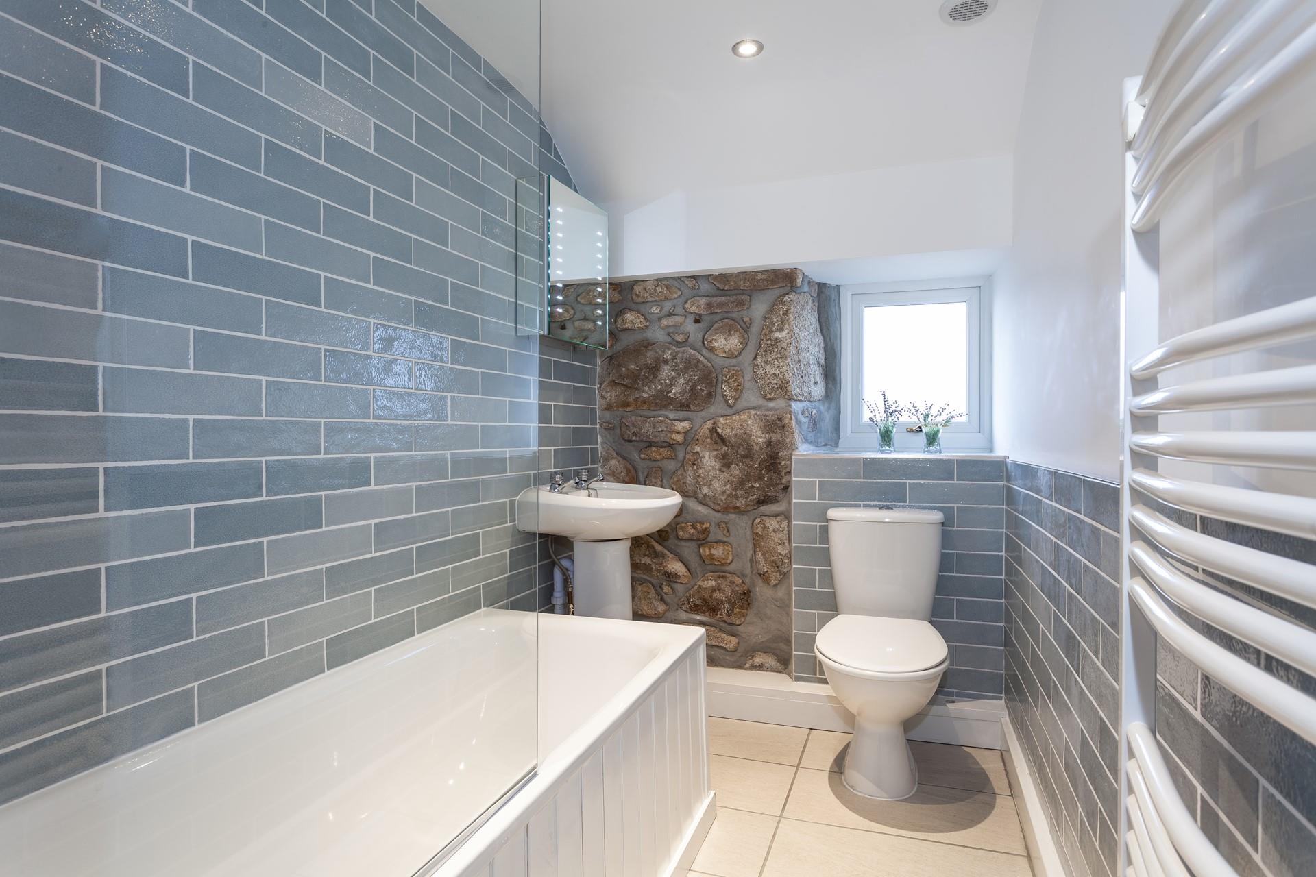 The bathroom is modern and stylish, a dream for getting ready each morning.