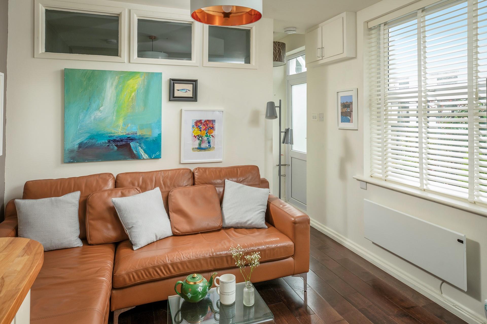 Relax on the sleek sofa after a busy day wandering the cobbled streets.