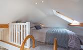 A ladder from the landing leads to the cosy mezzanine level with a double bed. - Thumbnail Image