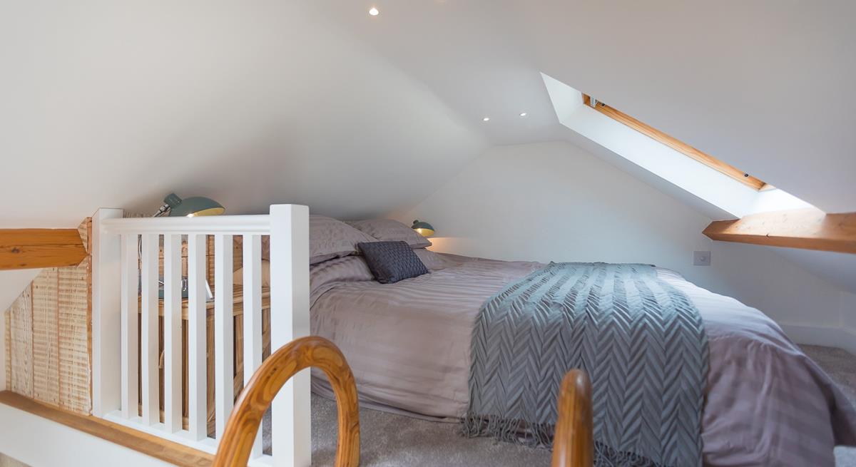 A ladder from the landing leads to the cosy mezzanine level with a double bed.
