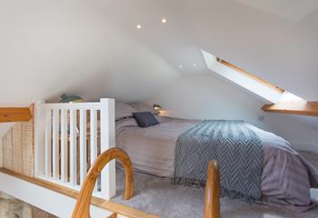A ladder from the landing leads to the cosy mezzanine level with a double bed.