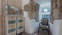 This quiet corner is perfect for tucking yourself away and enjoying a good book.
