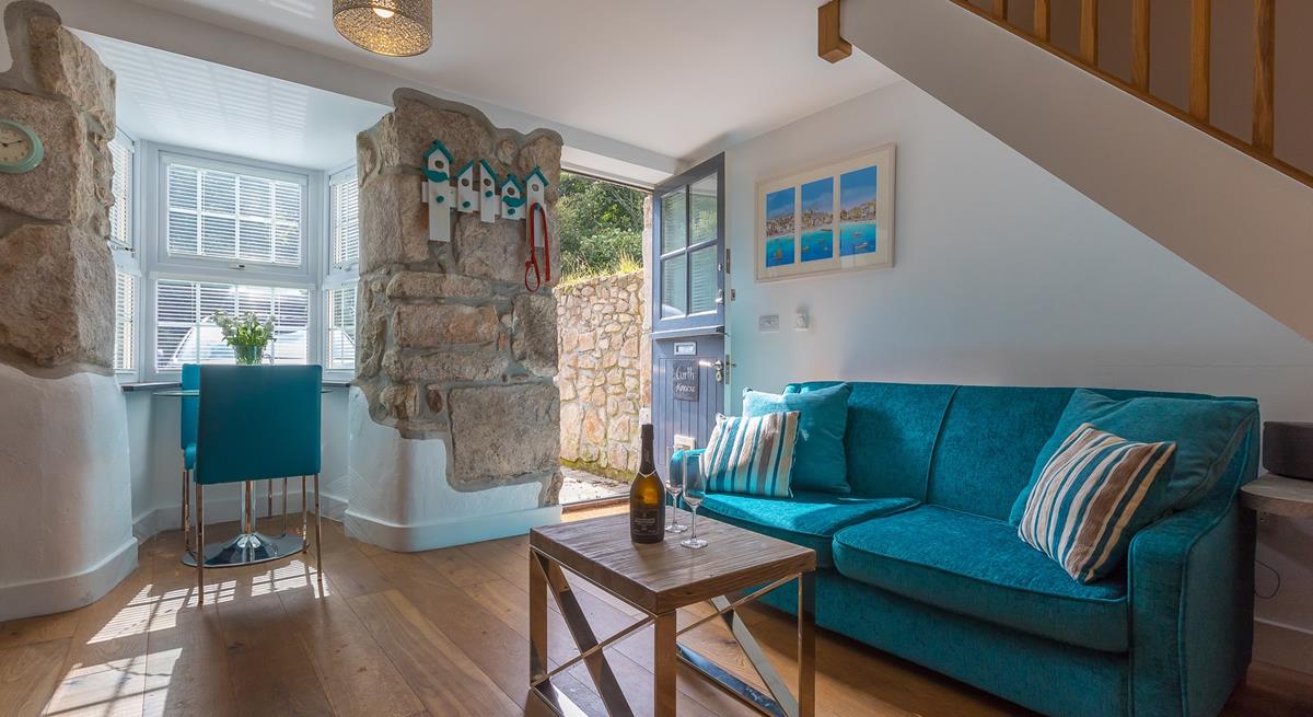 Exposed granite walls, wooden flooring and a stable door create a quaint cottage feel at Garth Annexe.