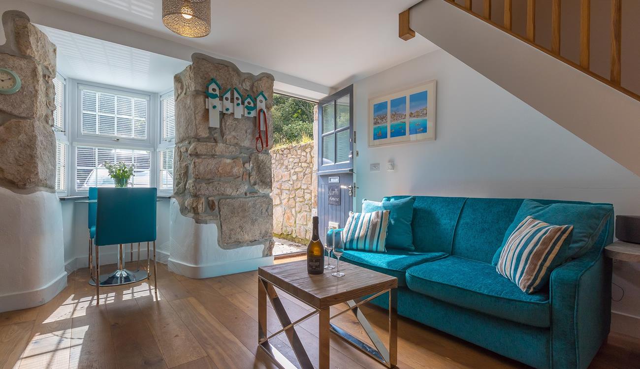 Exposed granite walls, wooden flooring and a stable door create a quaint cottage feel at Garth Annexe.