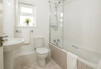 The family bathroom is finished in calming neutral tones. 