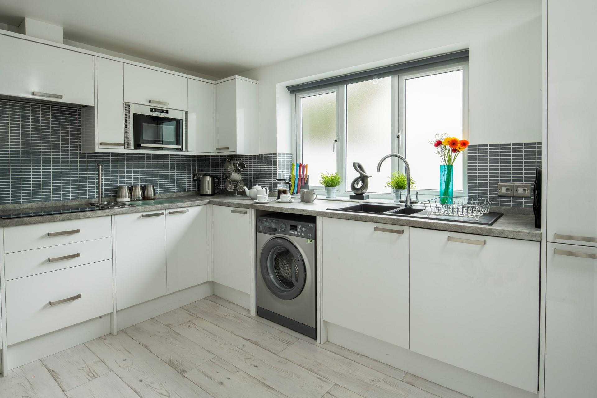 The kitchen is spacious with enough space for all the family. 