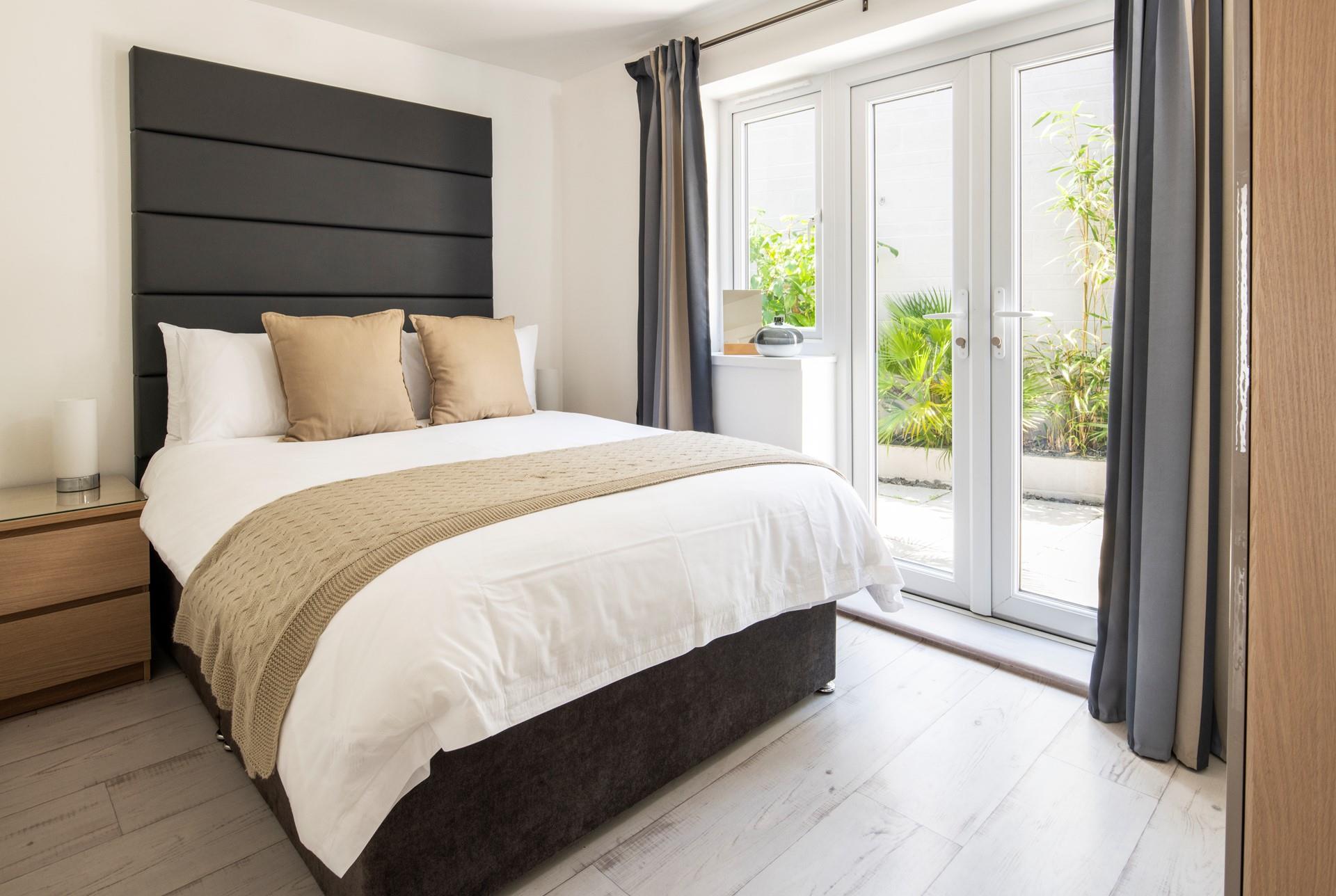 Bedroom 3 features a patio door leading to the private patio.