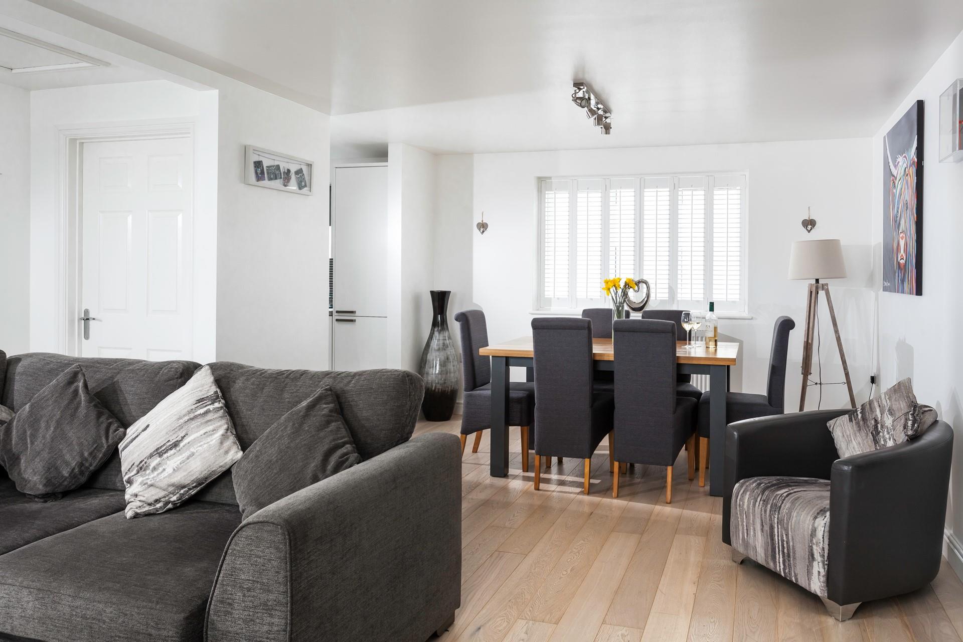 Finished to an incredibly high standard, the open plan living space is ideal for gathering together for a meal and drinks. 