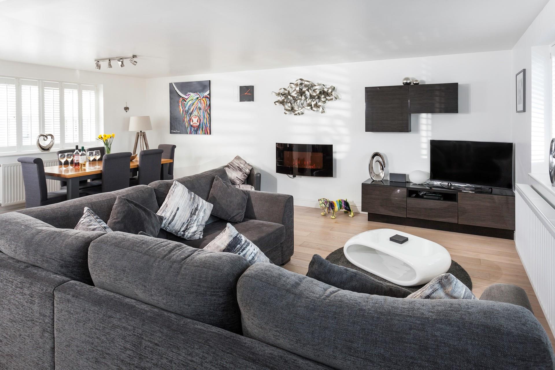 Sleek and stylish, the open plan living space is sophisticated yet comfortable. 