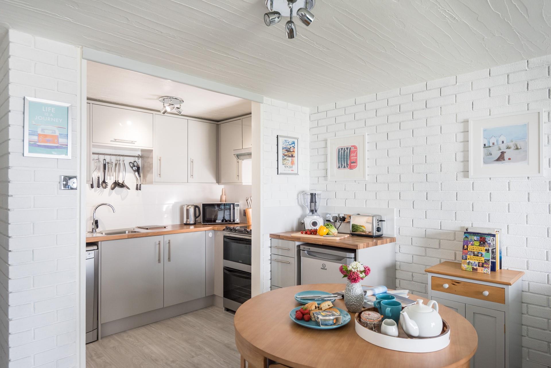 The kitchen is compact but well-equipped with all you need for a relaxing stay.