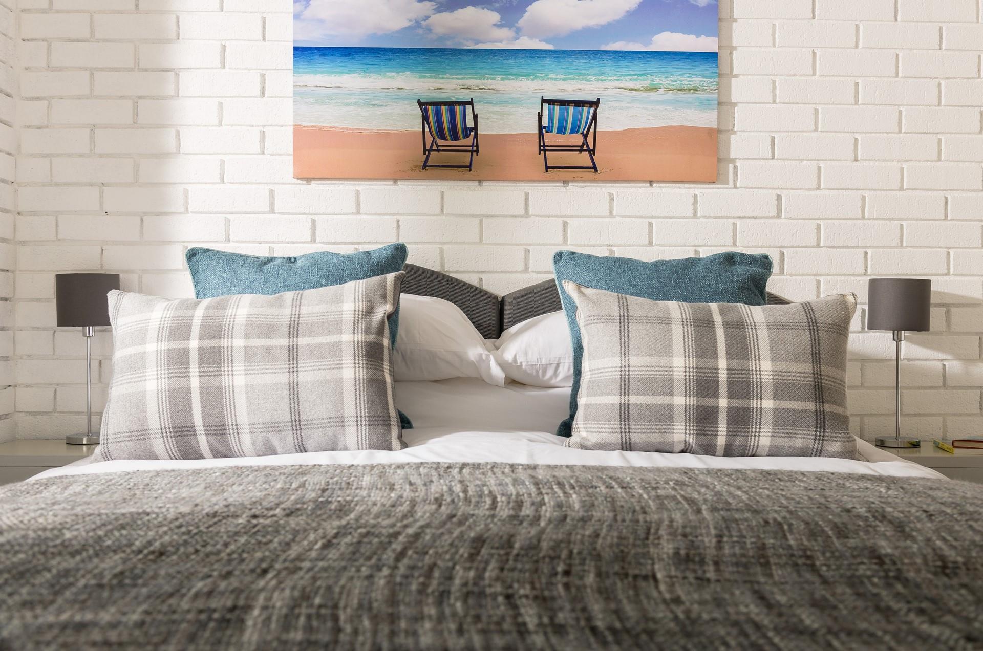 We love how the exposed, painted brick walls add to this property's character and charm.