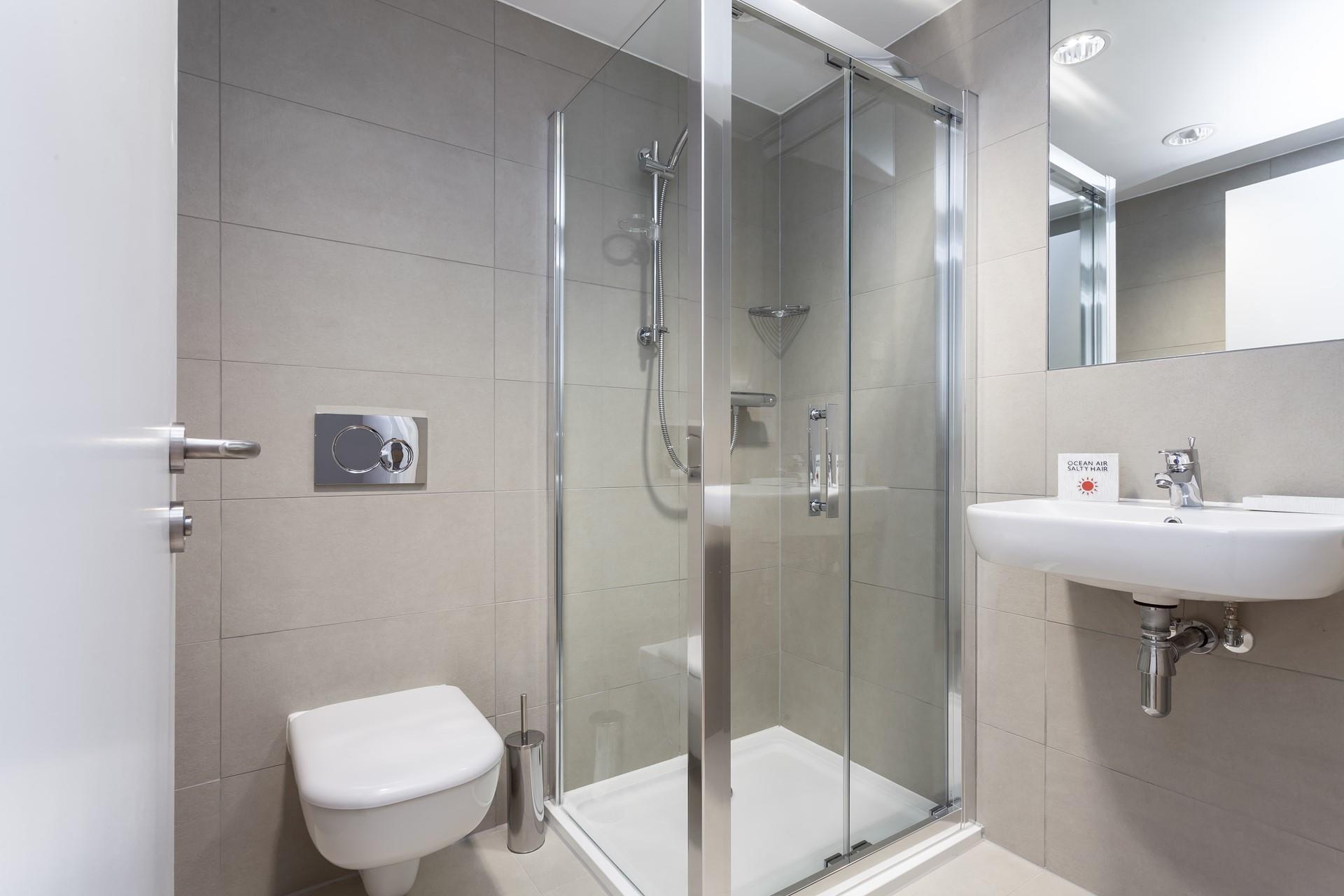 Wash off the sand in your shower before getting ready for an evening in town.