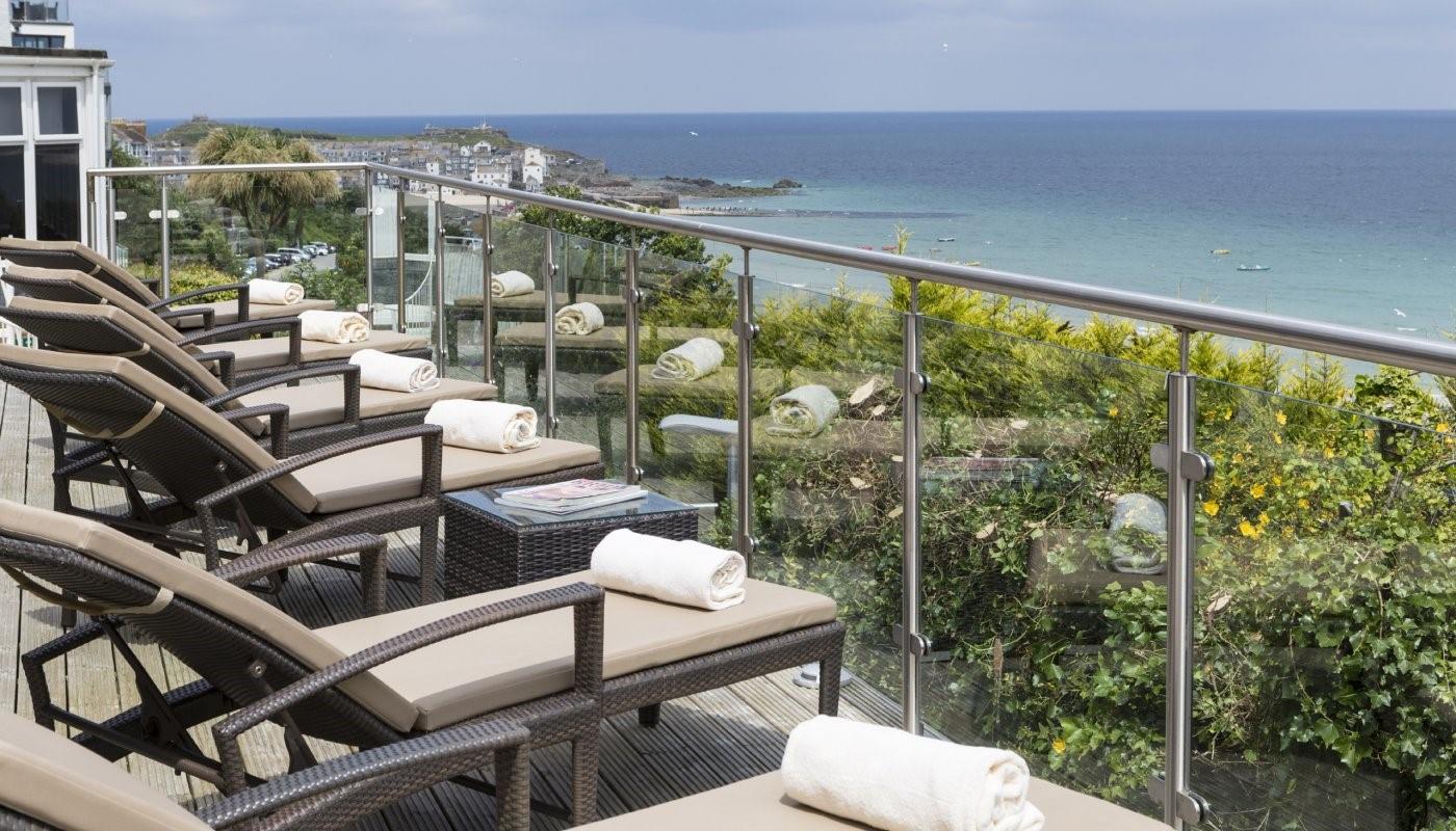 After a relaxing dip, take an afternoon siesta on the balcony loungers.