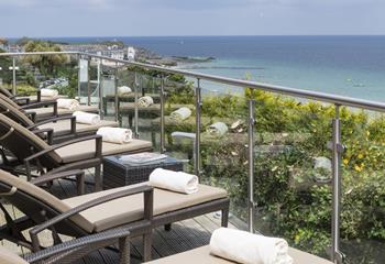 After a relaxing dip, take an afternoon siesta on the balcony loungers.