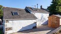 An open patio area at the back of this property. 