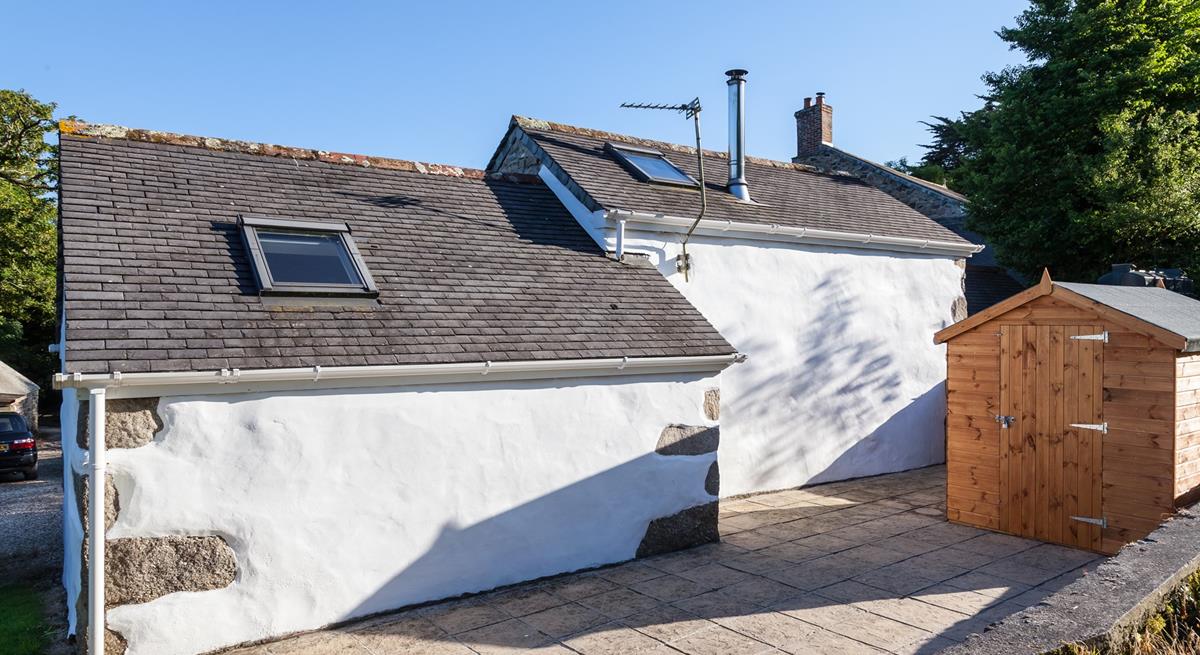 An open patio area at the back of this property. 