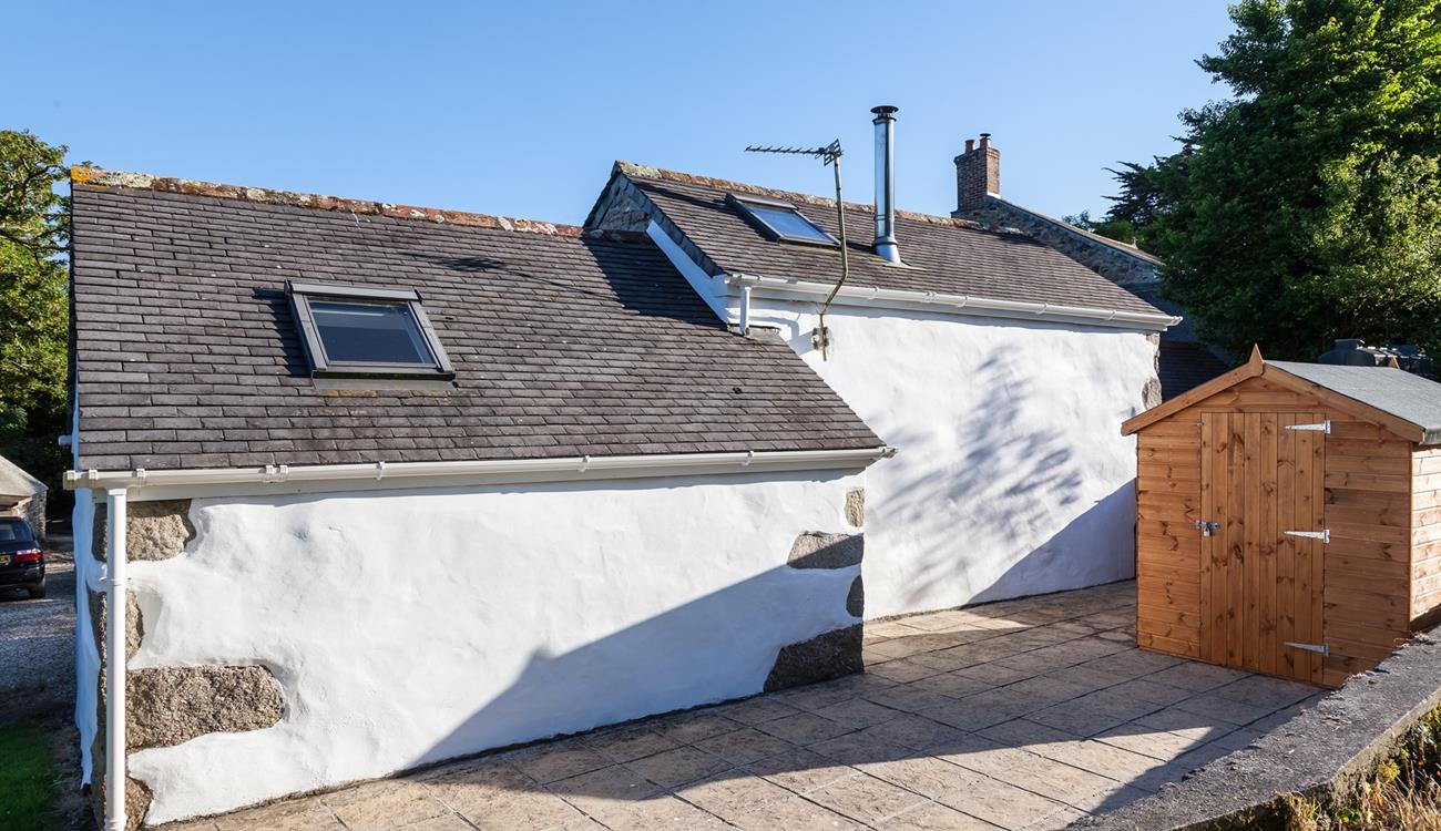 An open patio area at the back of this property. 