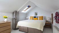 The king size bed provides a cosy night's sleep after a day of exploring.