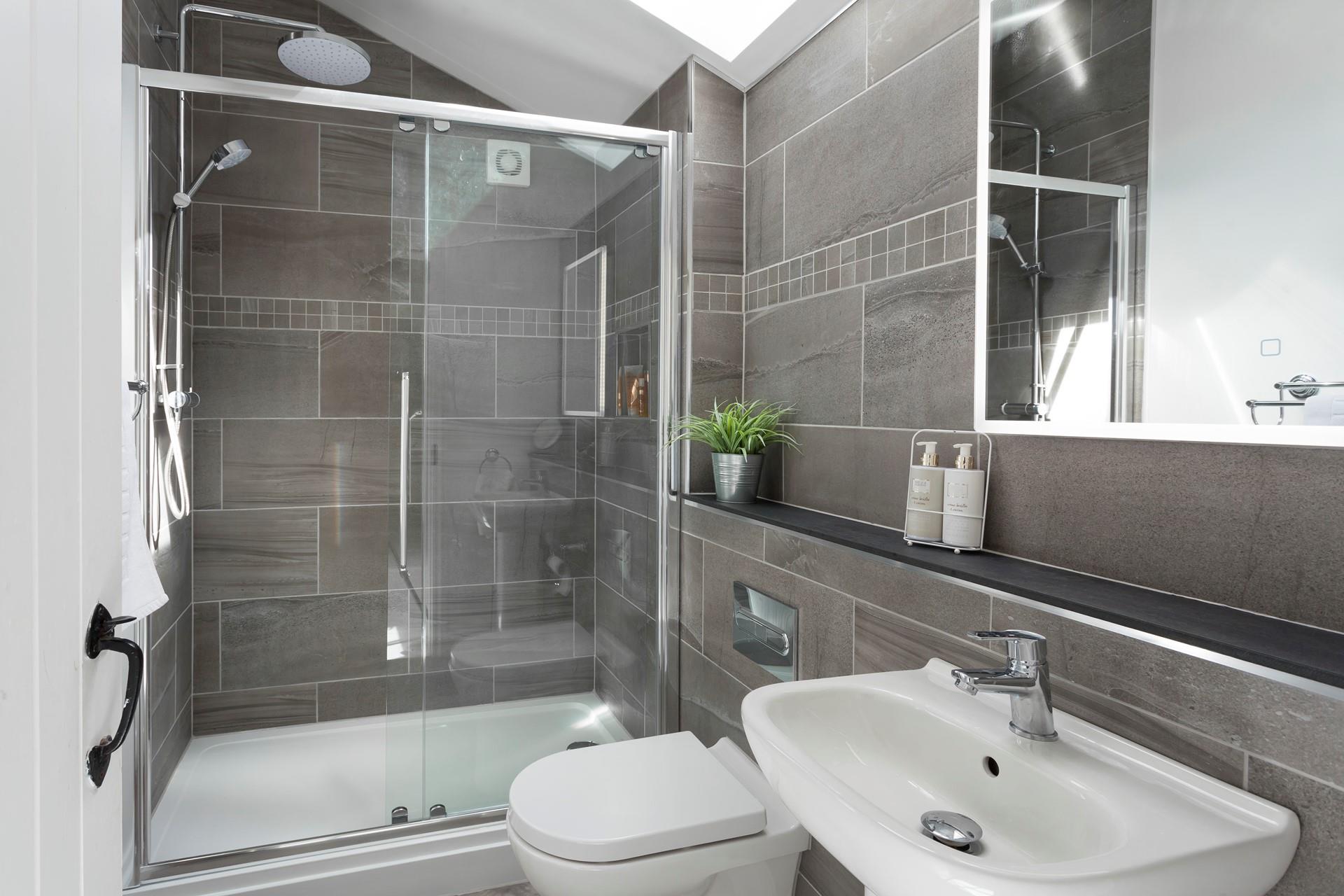 The bathroom has a large shower perfect for waking yourself up ready for the day.