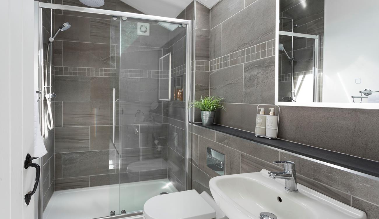 The bathroom has a large shower perfect for waking yourself up ready for the day.