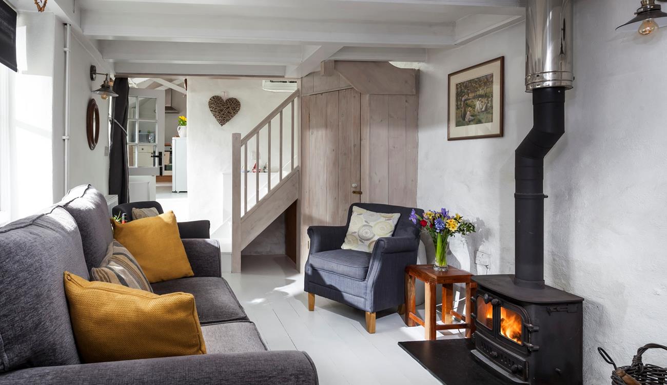 The cosy and quirky sitting room is perfect for snuggling up in front of the woodburner.