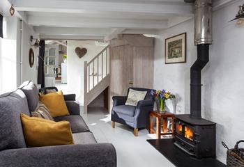 The cosy and quirky sitting room is perfect for snuggling up in front of the woodburner.
