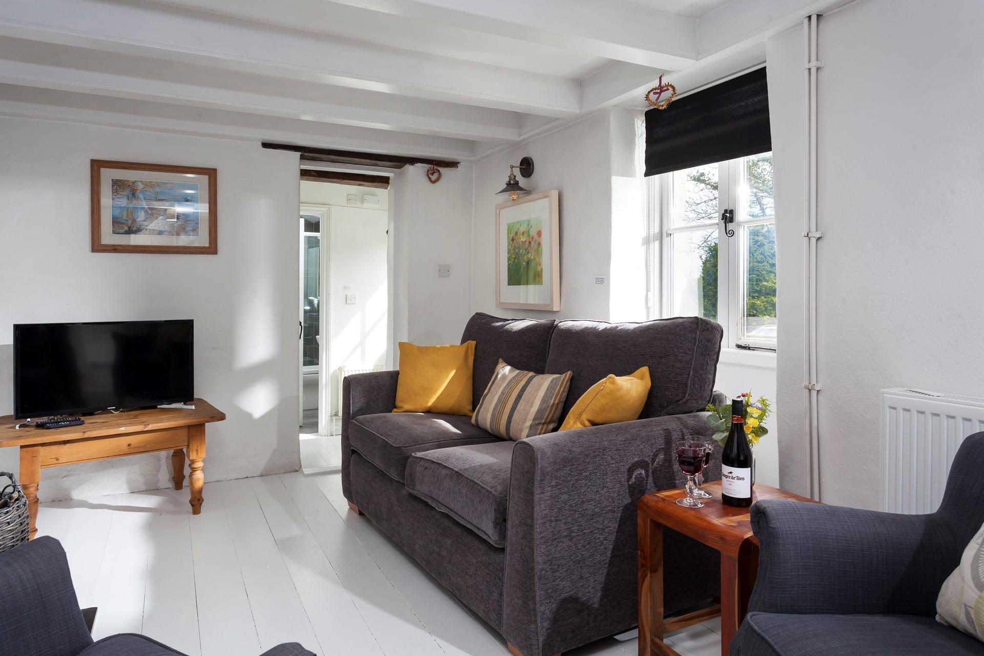 Enjoy a family evening in the homely sitting room. 