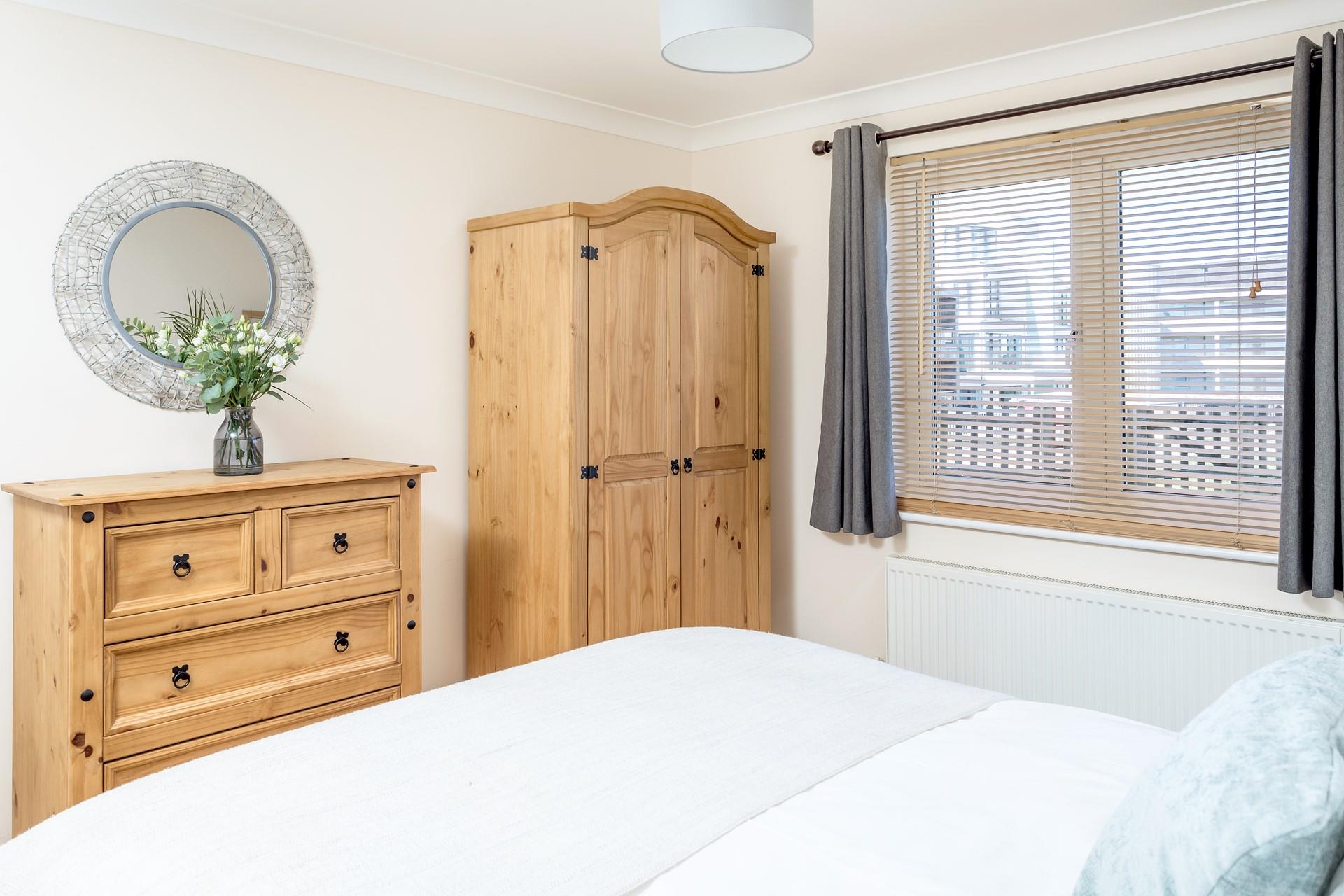 Bedroom 1 has a comfortable king size bed and own en suite with views of the sea and headland. 