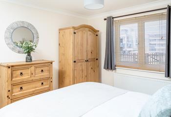 Bedroom 1 has a comfortable king size bed and own en suite with views of the sea and headland. 
