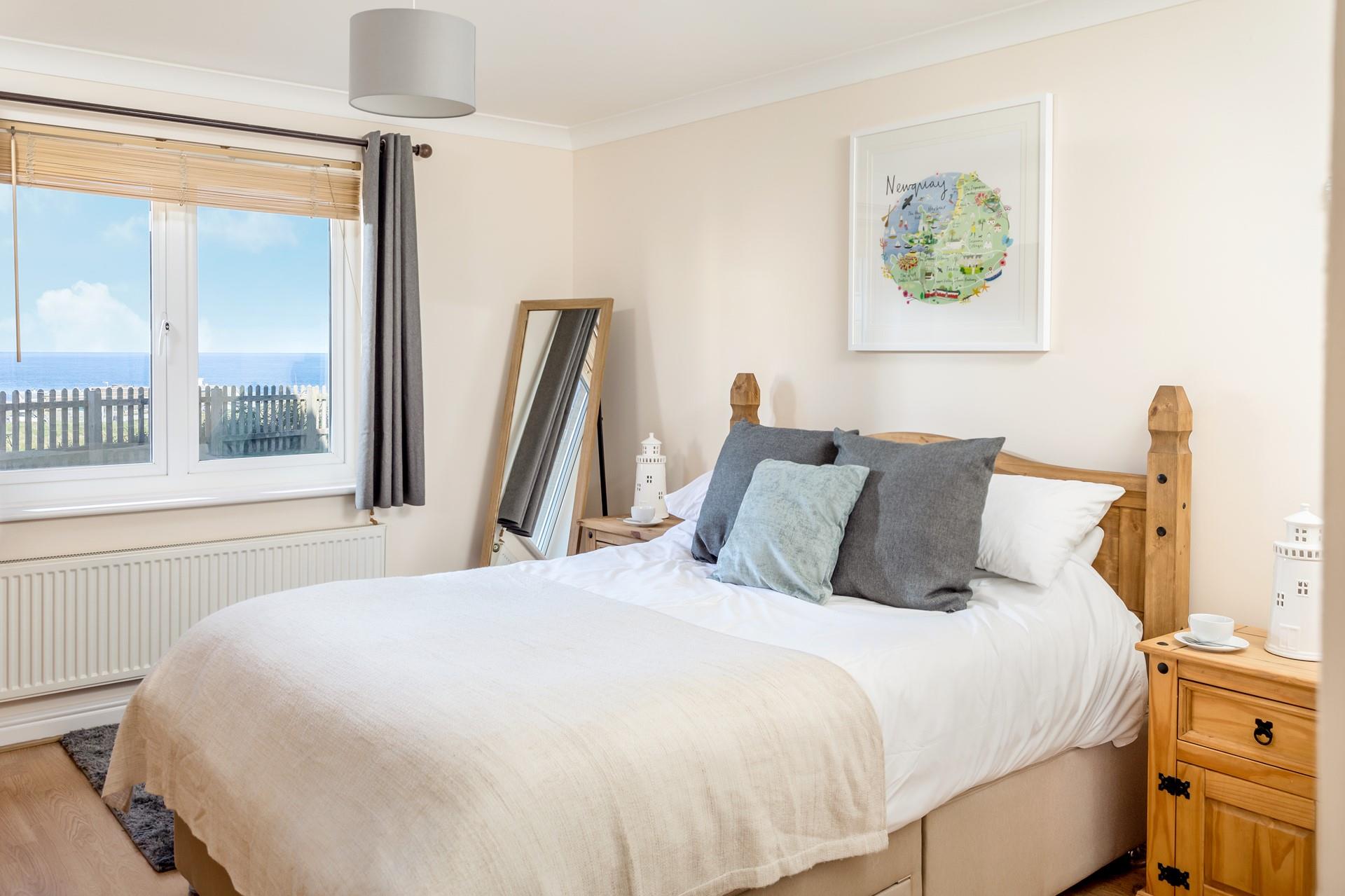 We love the bedroom's muted colours and adorable artwork!