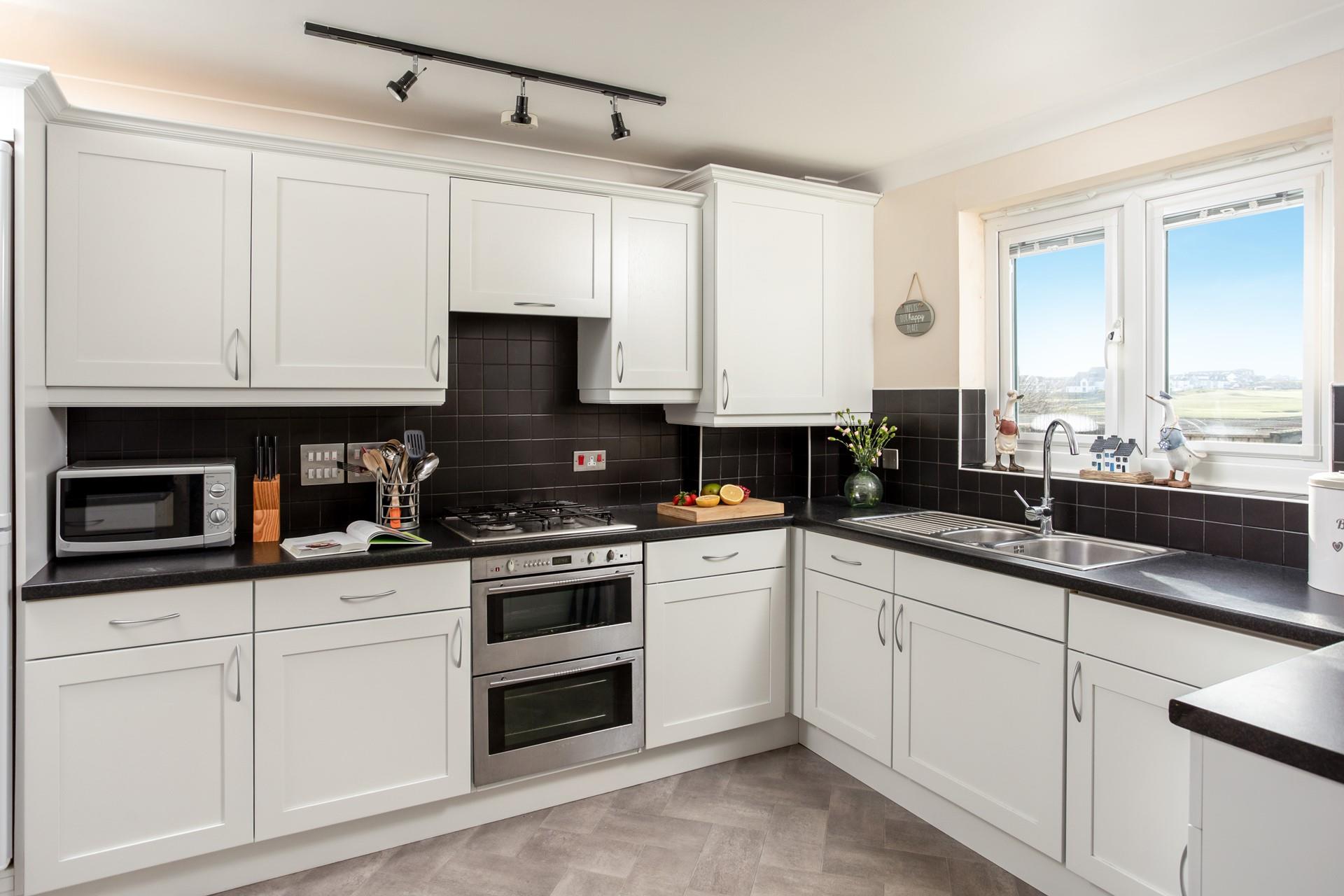 The kitchen is stylishly designed and well-equipped, perfect for cooking up a feast.