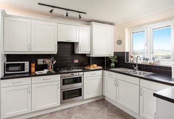The kitchen is stylishly designed and well-equipped, perfect for cooking up a feast.