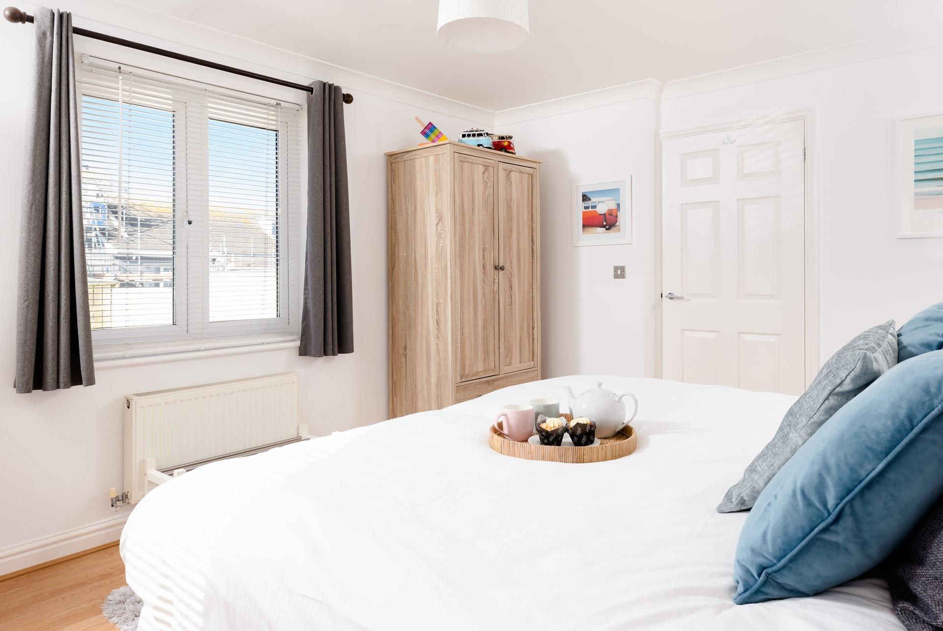 Bedroom 2 offers flexible sleeping arrangements, with zip and link beds that can be made as either twin or super king.