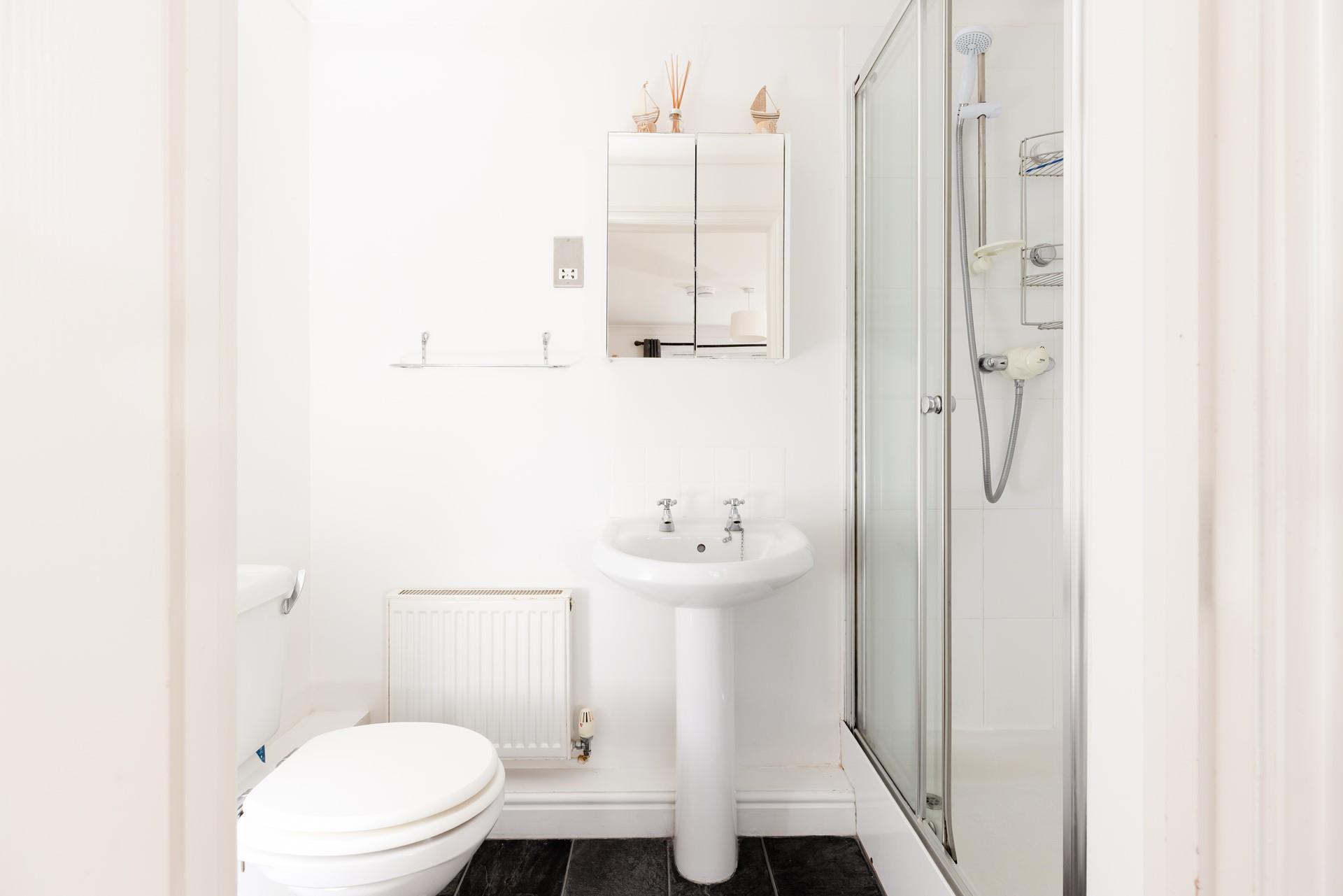 The master bedroom has an en suite shower room, offering space and privacy to get ready.