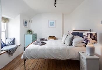 Bedroom 1 has a cosy feel with a large king size bed that promises a perfect night's sleep.